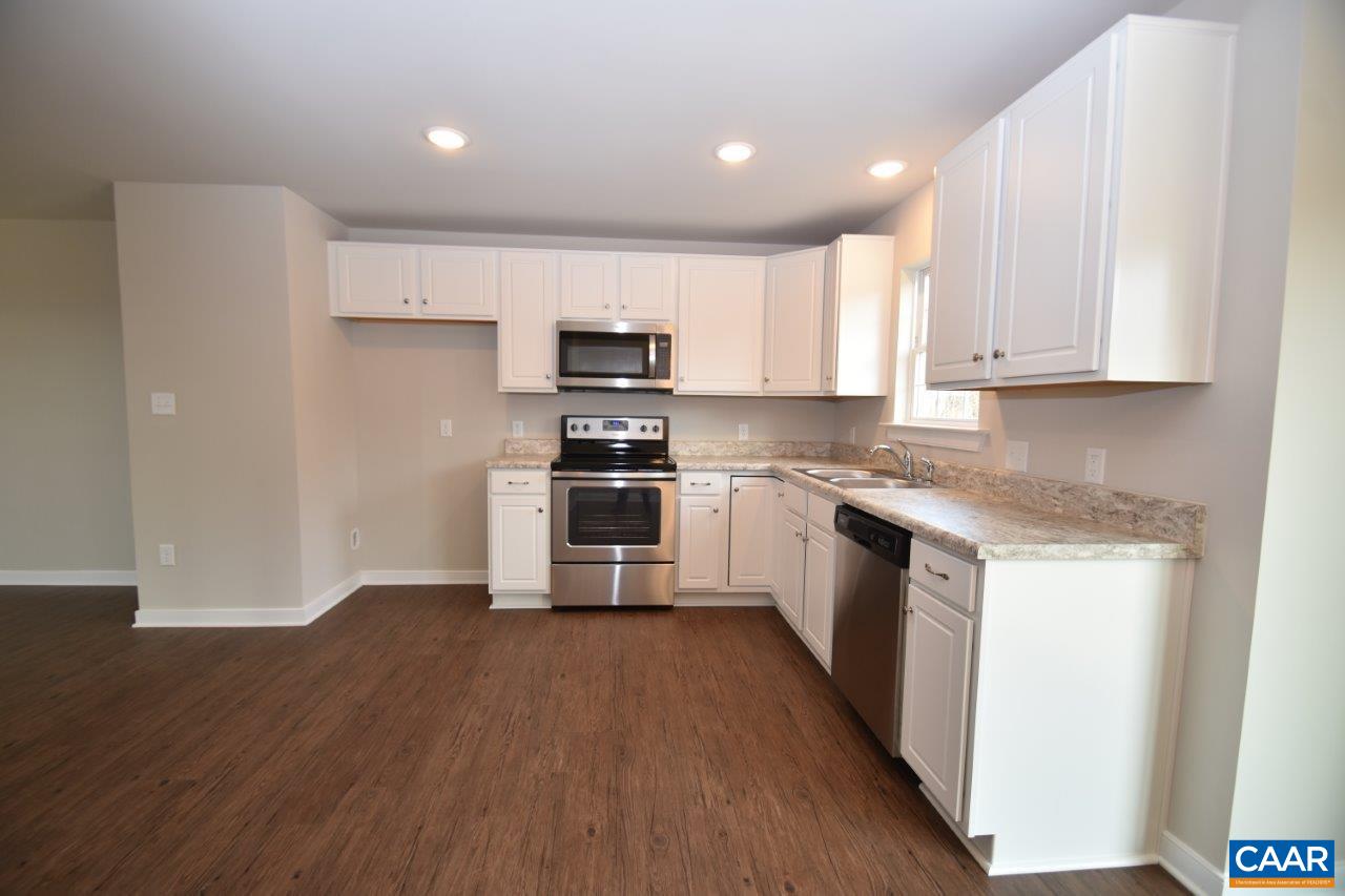 21 Brougham Road, Unit LOT 125/8 Palmyra, VA 22963 - Photo 8 of 24 a kitchen with a sink a microwave a stove and cabinets