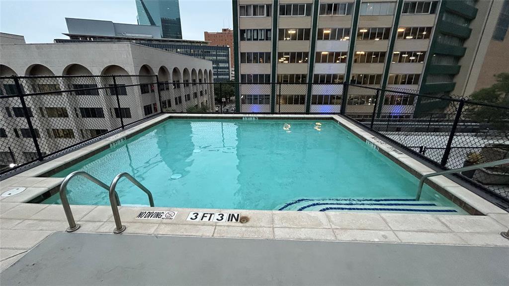 a view of swimming pool with a balcony
