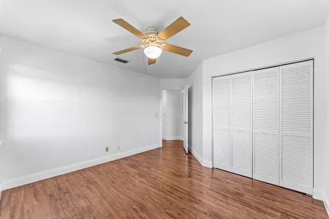 a view of hallway with wooden floor