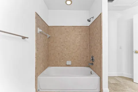 a bathroom with a sink vanity and a toilet