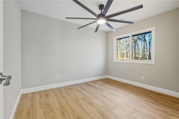 a view of balcony with wooden floor