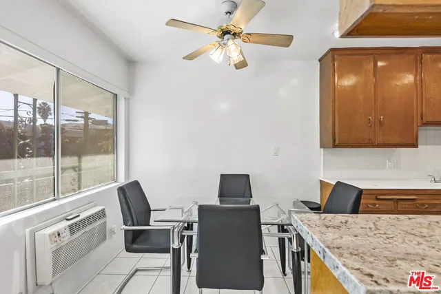a kitchen with stainless steel appliances granite countertop a sink and a stove