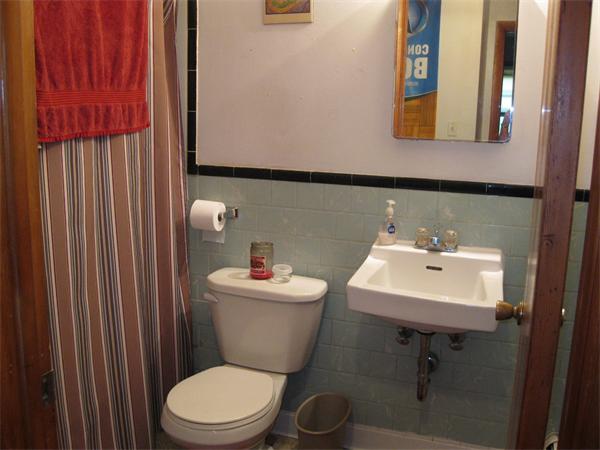 454-468 Morgan Road West Springfield, MA 01089 - Photo 11 of 20 a bathroom with a toilet a sink and mirror