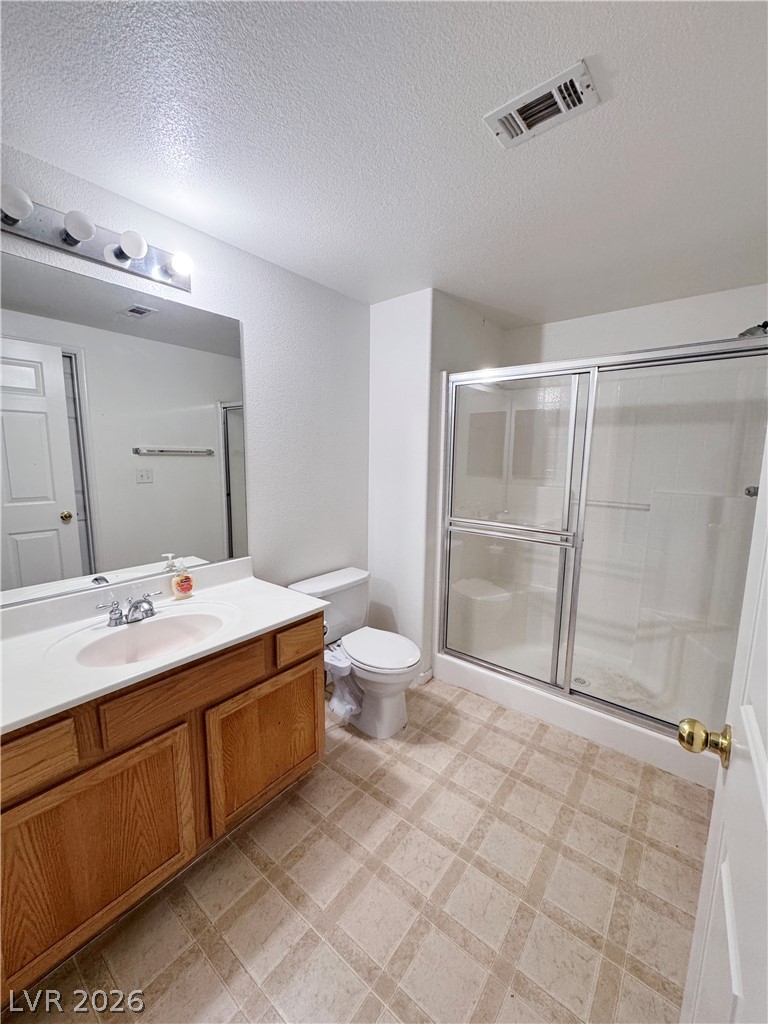 9580 West Reno Avenue, Unit 242 Las Vegas, NV 89148 - Photo 18 of 26 A functional bathroom offers a single vanity with ample counter space and a convenient shower stall.