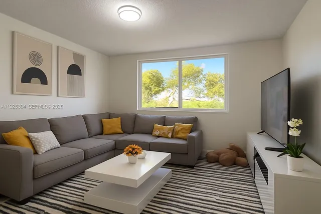 a living room with furniture and a large window