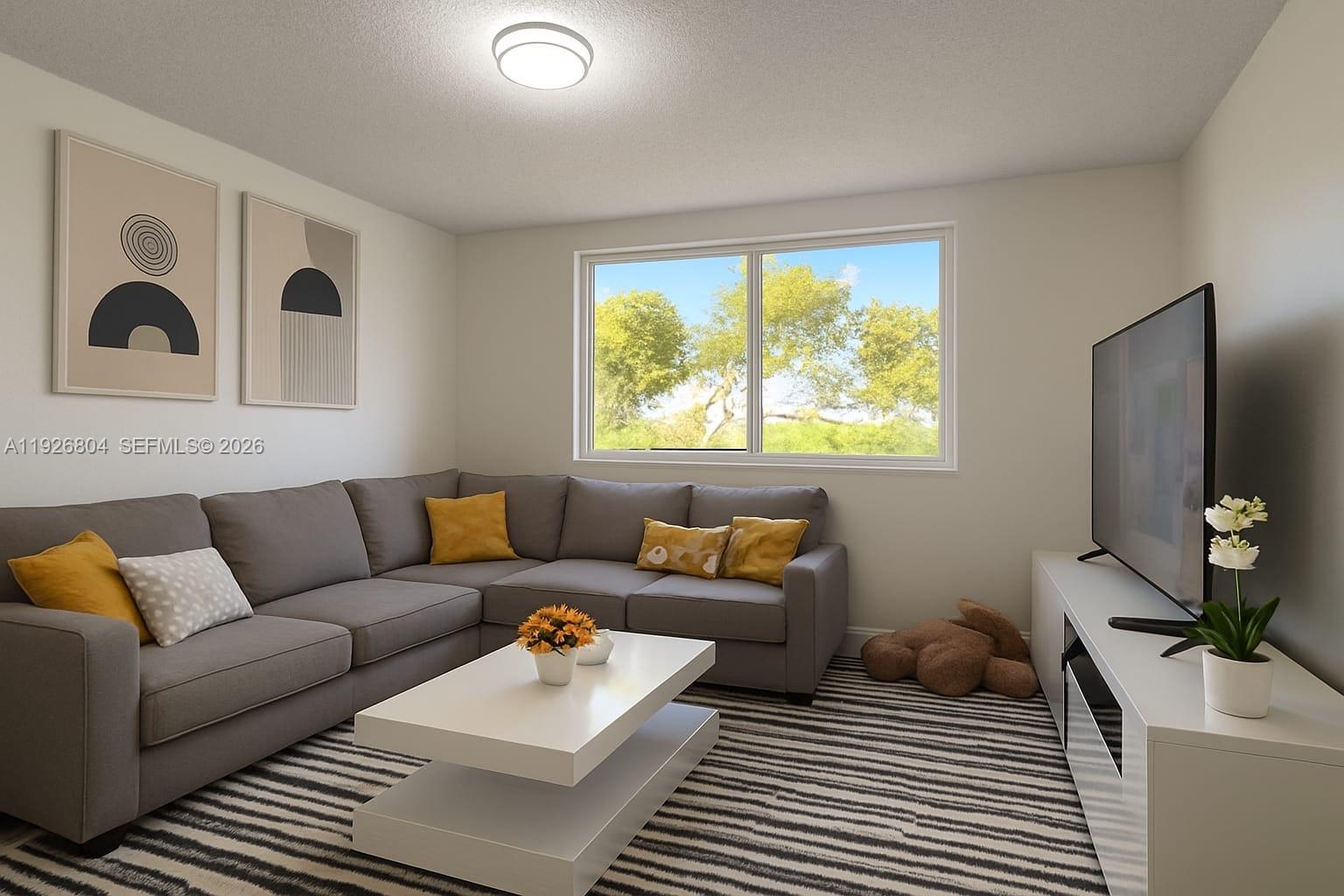 a living room with furniture and a large window