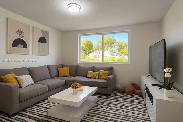 a living room with furniture and a large window