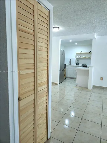 a bathroom with a mirror and a shower