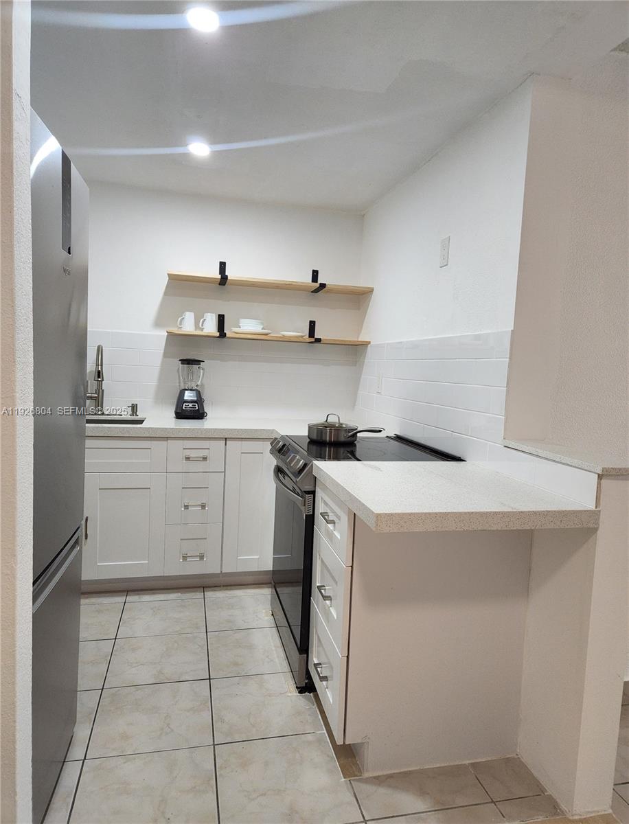 666 West 81st Street, Unit 209 Hialeah, FL 33014 - Photo 5 of 16