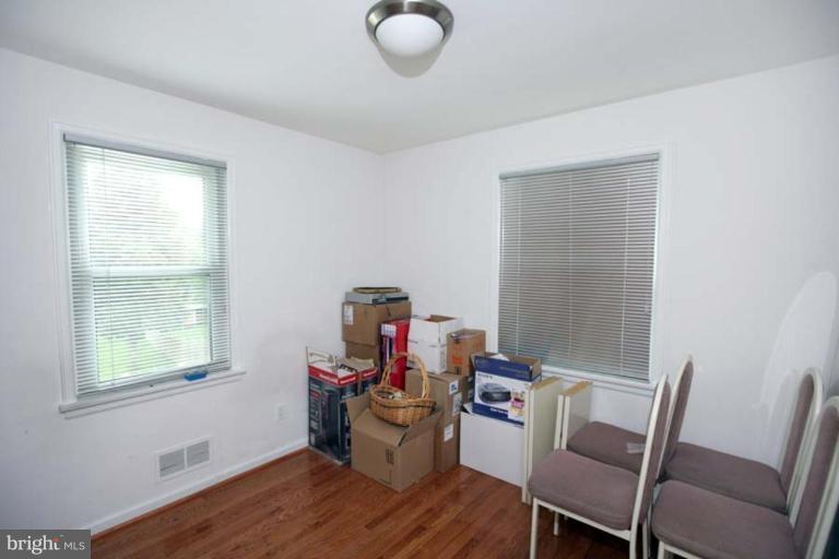 1824 Bonifant Road Silver Spring, MD 20906 - Photo 8 of 12 a view of a workspace with furniture and a window