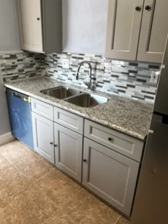 a sink with granite top