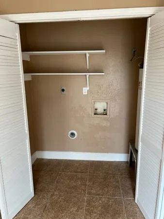 a kitchen with granite countertop a stove and a sink