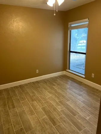 an empty room with a empty space and a window