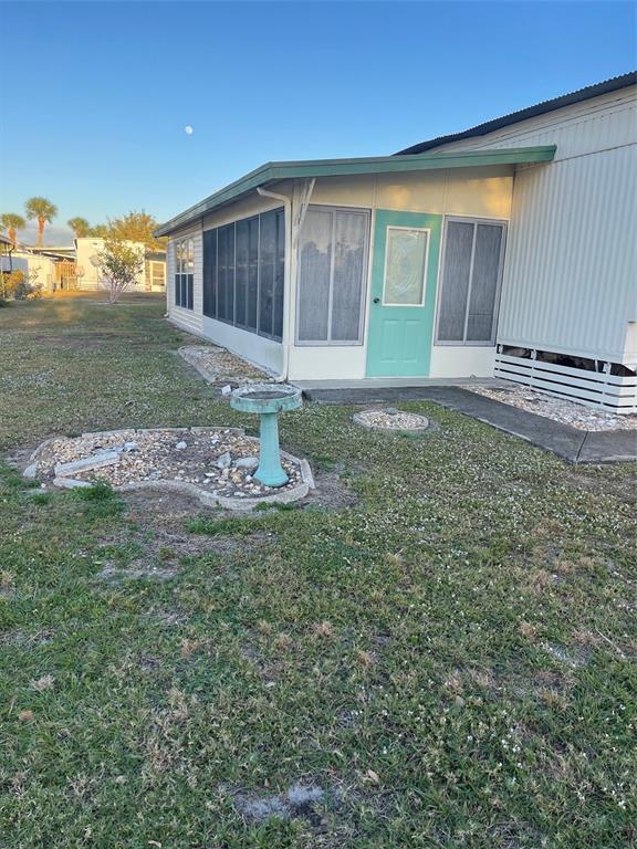 105 St Martins Way Apollo Beach, FL 33572 - Photo 2 of 6 a front view of a house with garden