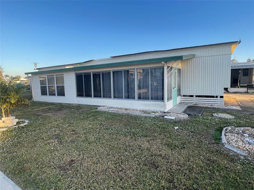105 St Martins Way Apollo Beach, FL 33572 - Photo 3 of 6 a front view of a house with garden