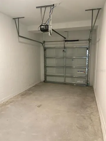 a front view of a building with a garden