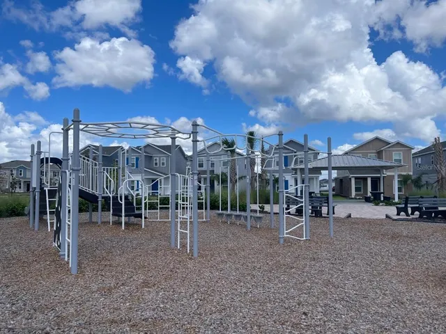 a view of a backyard with sitting area