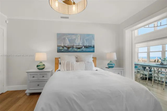 a bedroom with a bed and a table