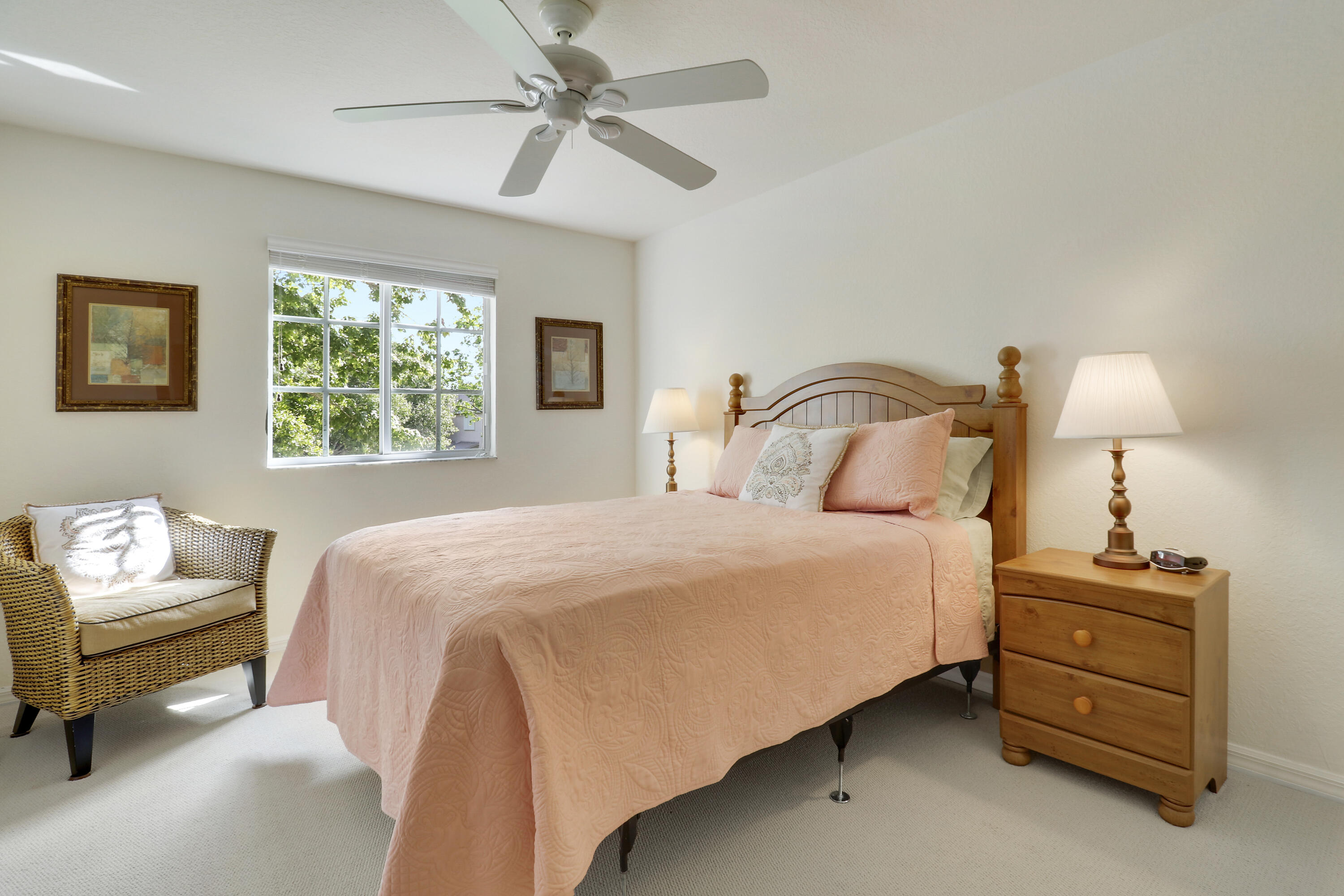5410 Southeast Mitchell Lane Stuart, FL 34997 - Photo 18 of 24 a bedroom with a bed and a couch