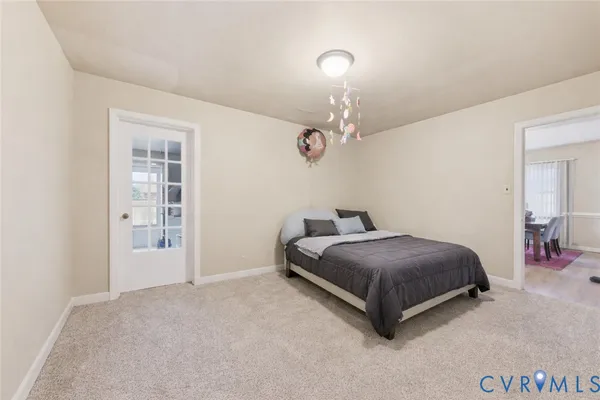 a spacious bedroom with a bed and cabinets