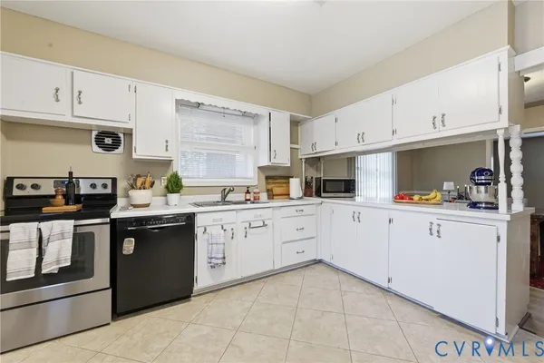 a kitchen with cabinets and appliances