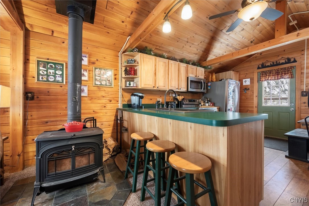 108 Long View East Webb, NY 13420 - Photo 11 of 23 Nice wood stove to warm up by