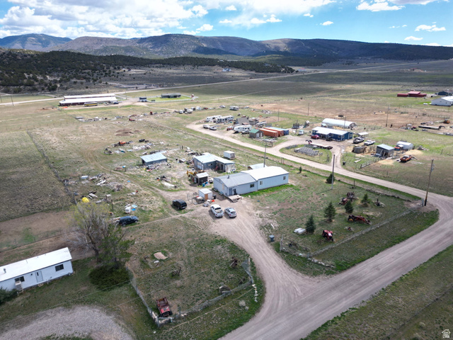 34030 North 7905th East Fairview, UT 84629 - Photo 1 of 30 Aerial view of property and surrounding area with rural landscape and mountains