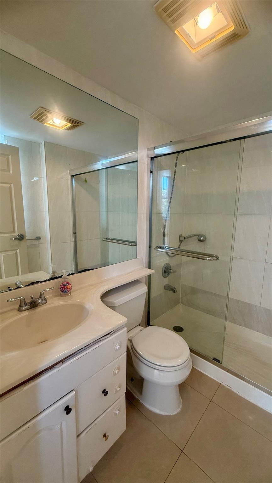 43-17 Union Street, Unit 6C Queens, NY 11355 - Photo 5 of 16 Bathroom with tile patterned flooring, vanity, and a stall shower