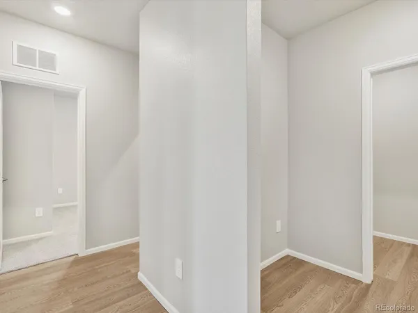 a view of small space with wooden floor