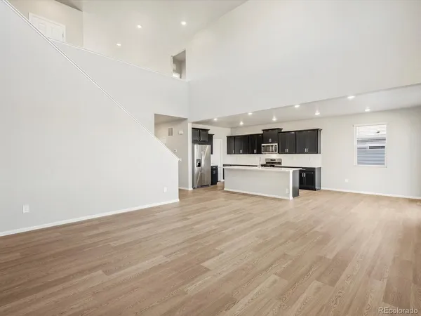 a view of a kitchen with a sink and a stove top oven