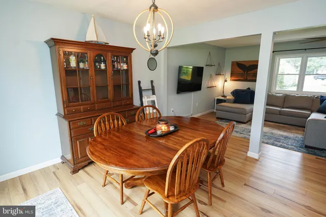 a kitchen with stainless steel appliances a stove a sink dishwasher and a refrigerator