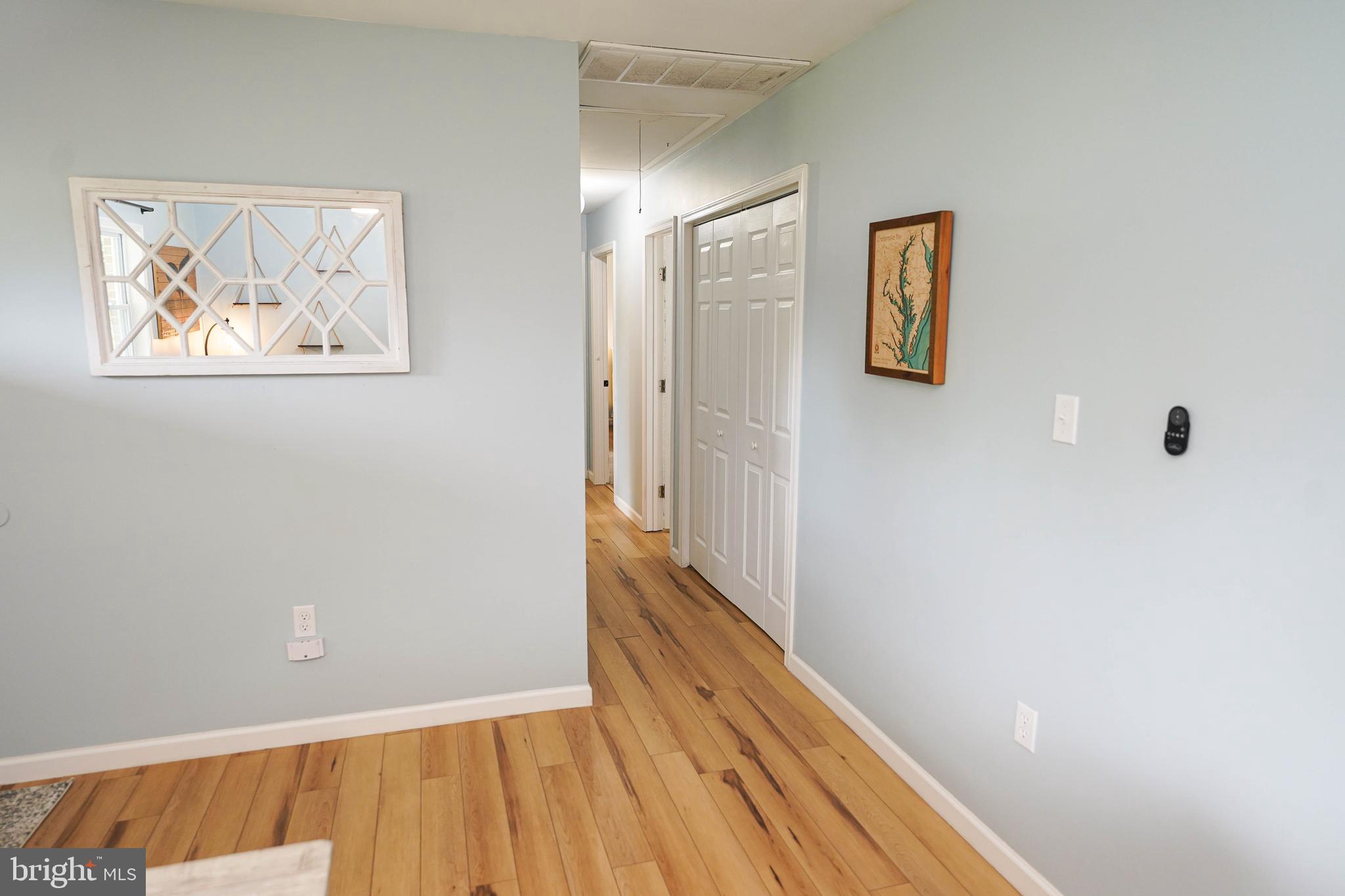 7209 Opal Circle Hebron, MD 21830 - Photo 24 of 41 a view of a hallway with wooden floor