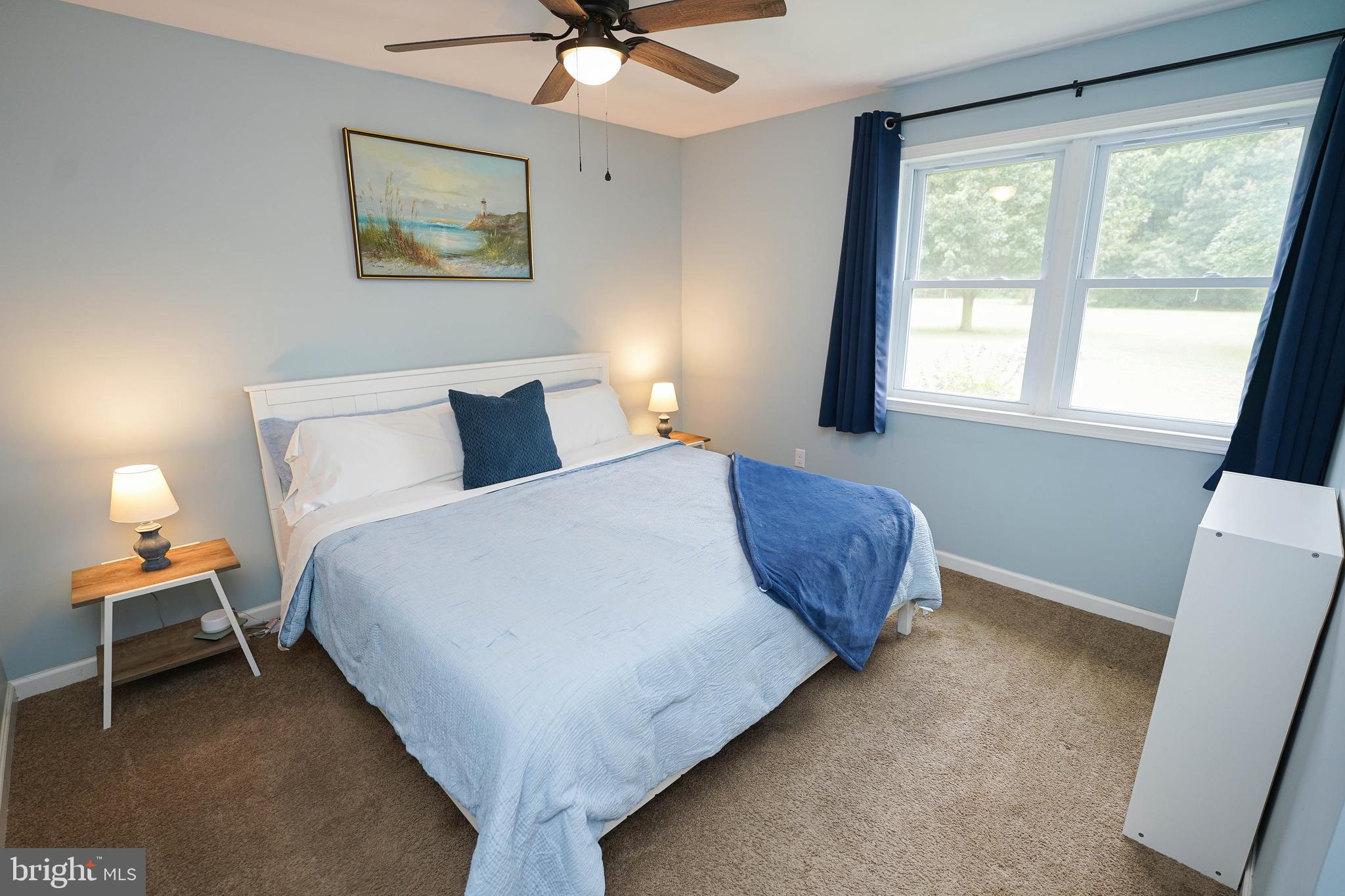 7209 Opal Circle Hebron, MD 21830 - Photo 26 of 41 a bedroom with a bed and a window