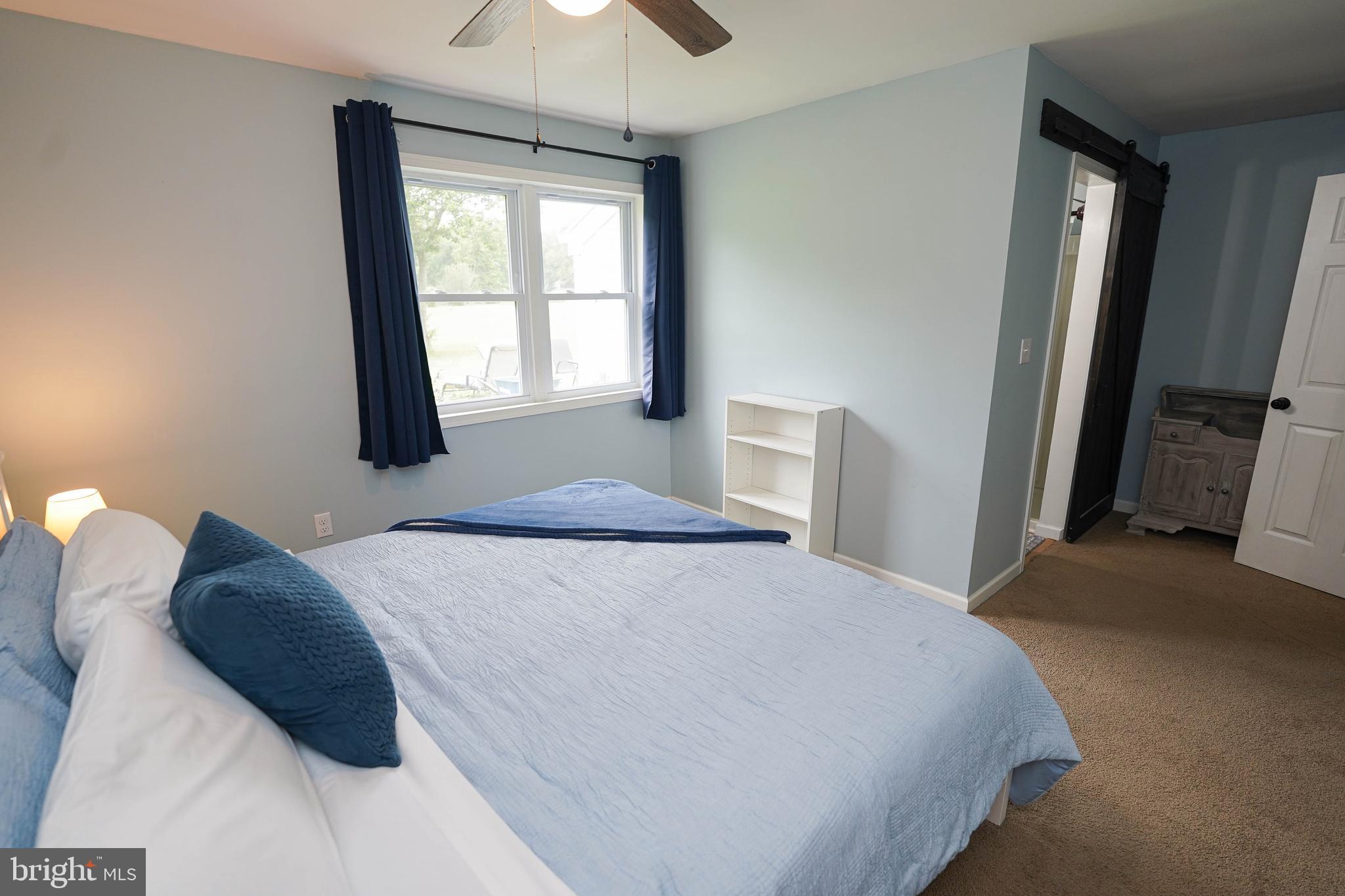 7209 Opal Circle Hebron, MD 21830 - Photo 29 of 41 a bedroom with a bed and a window