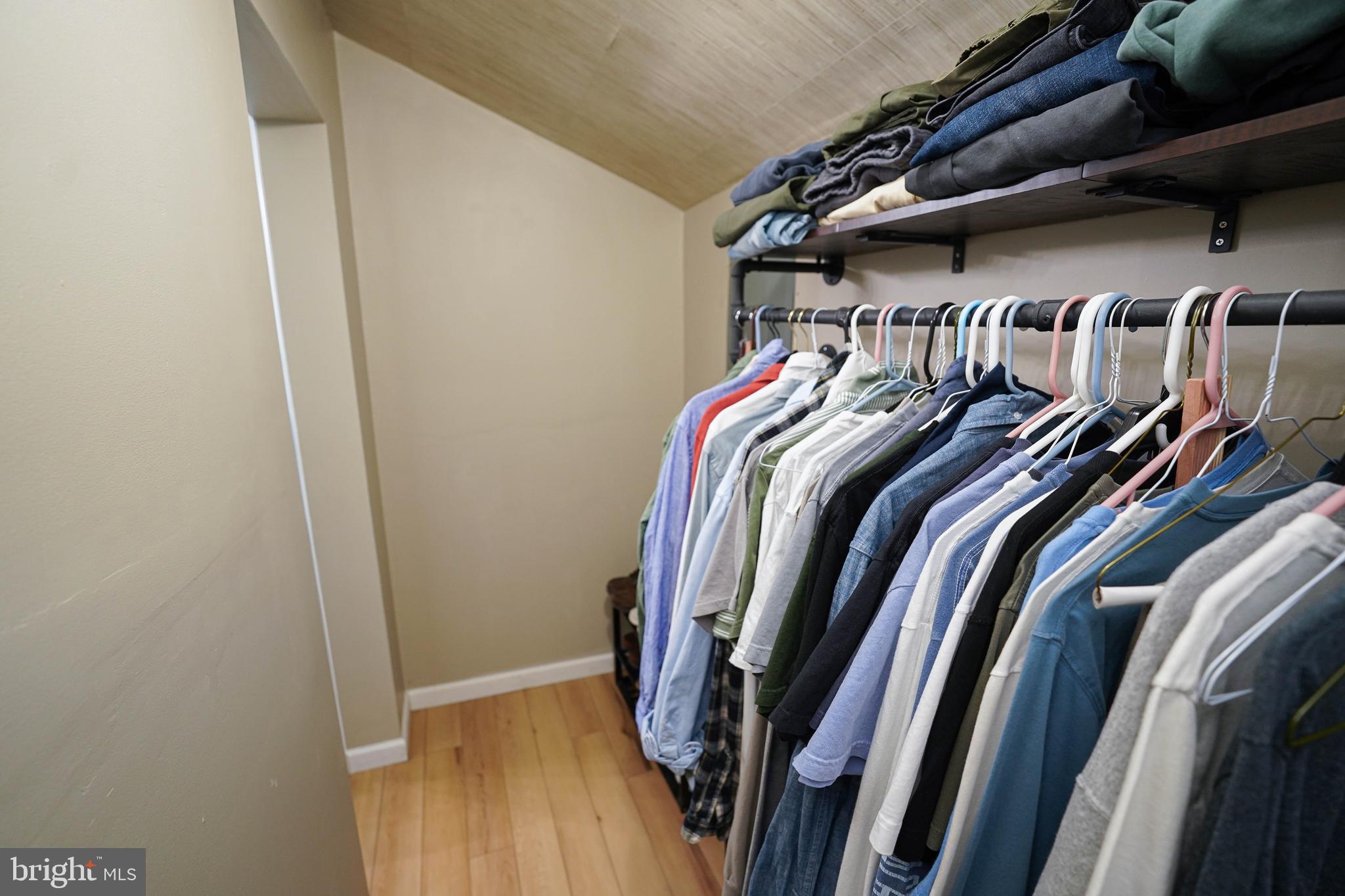 7209 Opal Circle Hebron, MD 21830 - Photo 32 of 41 a view of walk in closet with clothes and shoes