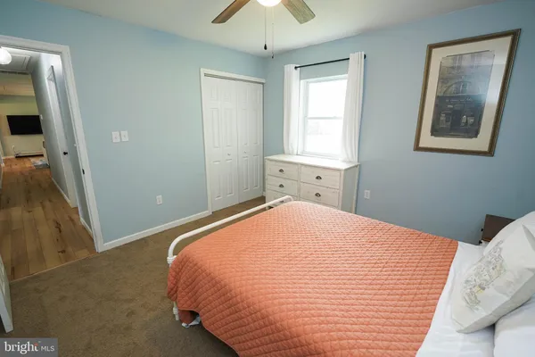 a bed room with a bed and a baby crib