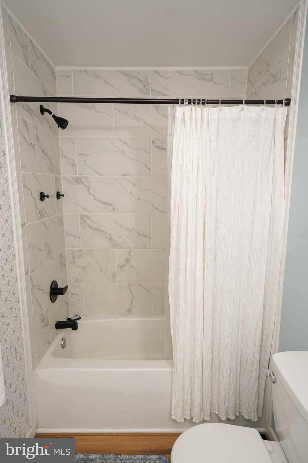 7209 Opal Circle Hebron, MD 21830 - Photo 38 of 41 a bathroom with a bathtub and shower