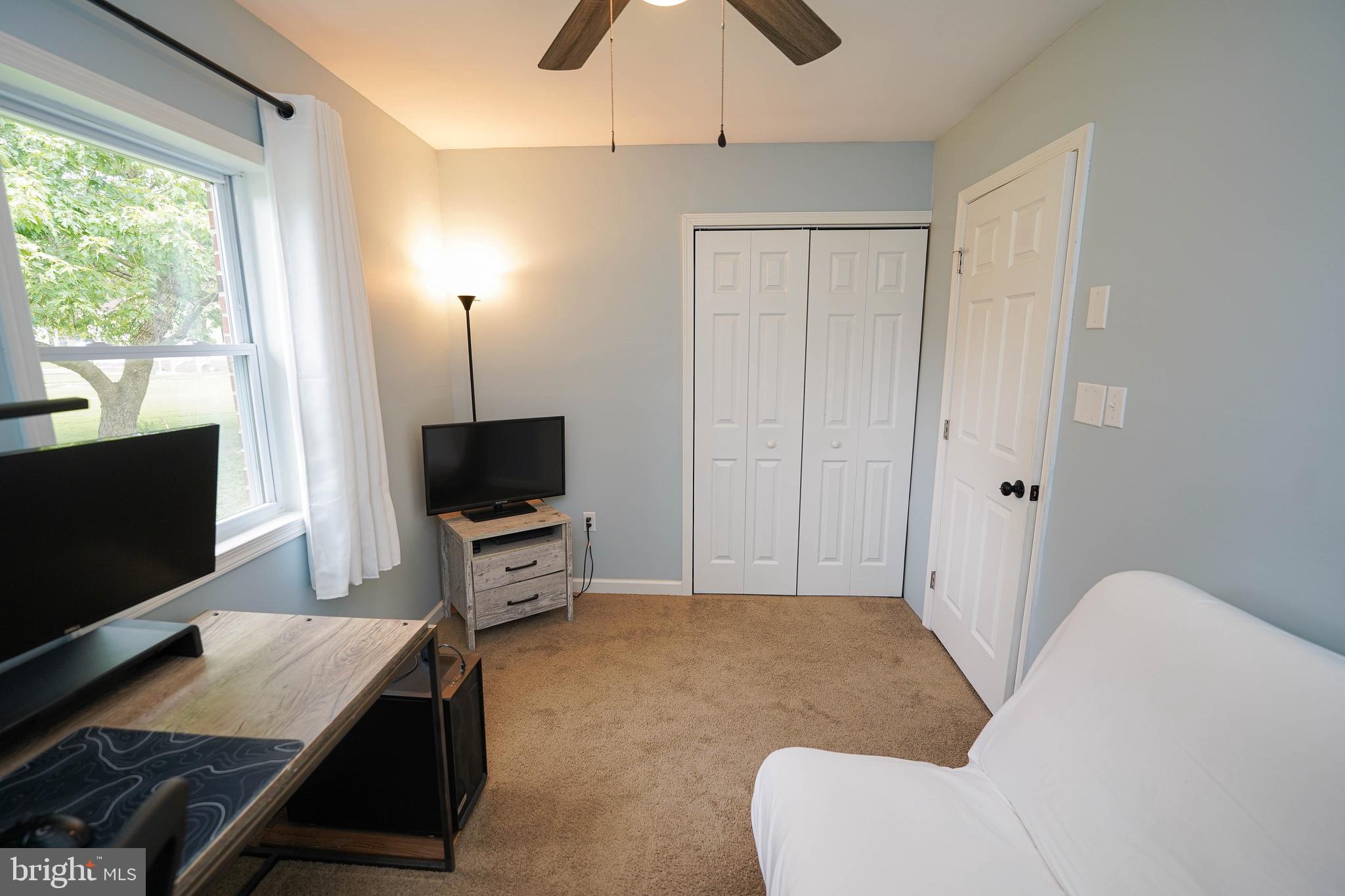 7209 Opal Circle Hebron, MD 21830 - Photo 41 of 41 a living room with furniture and a flat screen tv