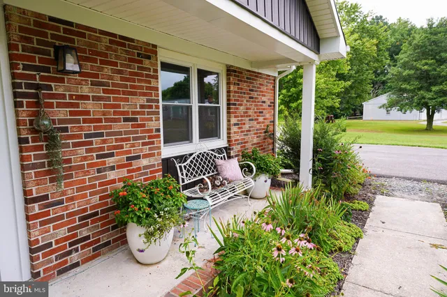 a view of front door and porch with seating space