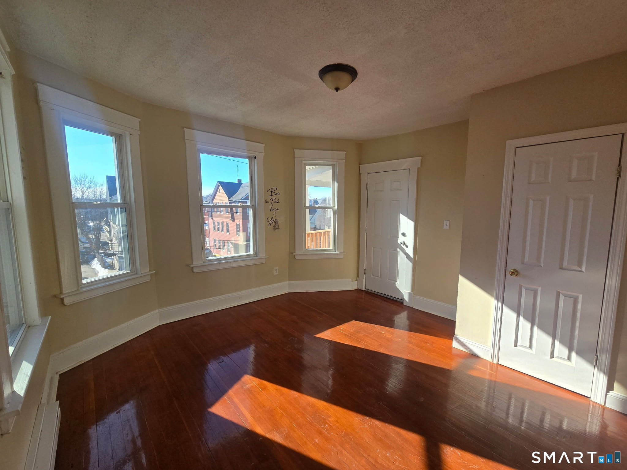 75 Alma Street Waterbury, CT 06705 - Photo 3 of 6 a view of an empty room and window