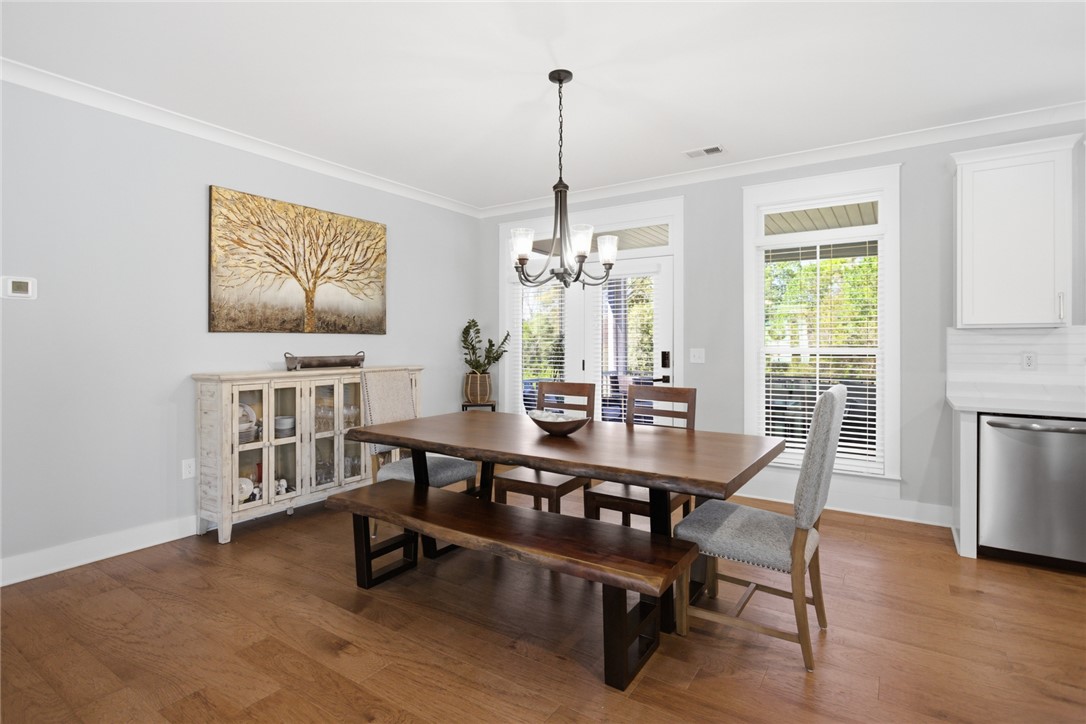 318 Summerall Drive Anderson, SC 29621 - Photo 13 of 42 This dining area features hardwood flooring, crown molding, and abundant natural light.