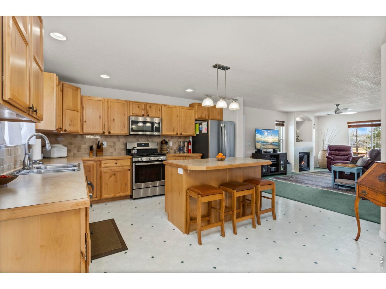 2868 Pleasant Valley Road Fort Collins, CO 80521 - Photo 14 of 30 Knotty alder cabinets feature pull-out shelving