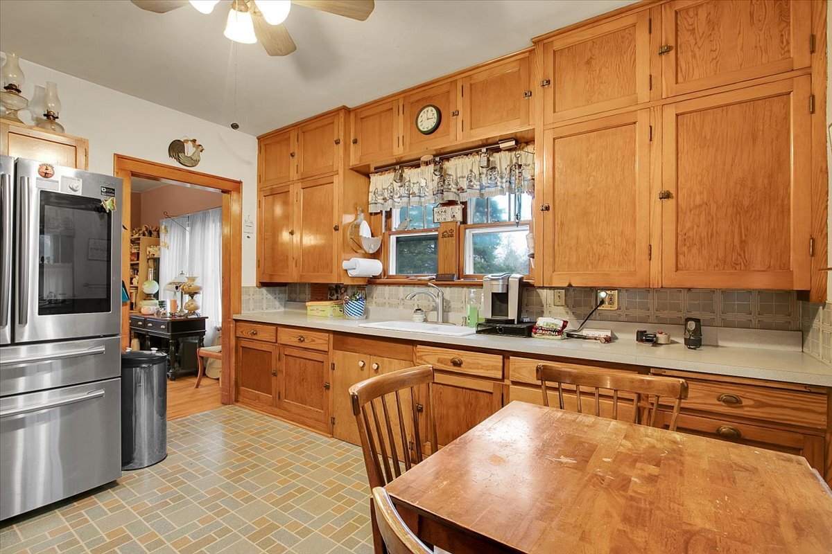 24447 Caton Farm Road Plainfield, IL 60586 - Photo 11 of 27 a kitchen with stainless steel appliances a sink and cabinets