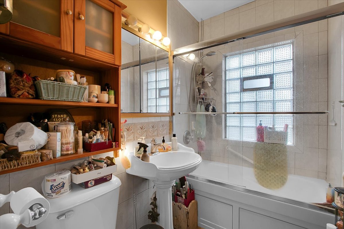 24447 Caton Farm Road Plainfield, IL 60586 - Photo 16 of 27 a bathroom with a sink and a mirror