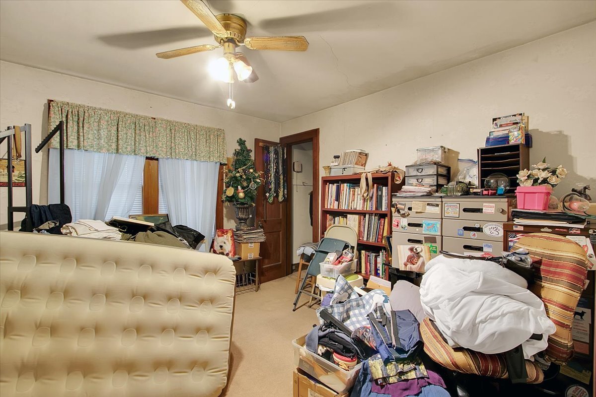 24447 Caton Farm Road Plainfield, IL 60586 - Photo 18 of 27 a bedroom with bed and a bookshelf