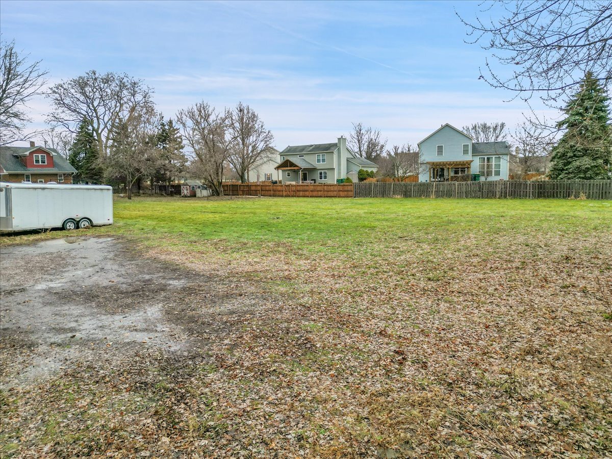 24447 Caton Farm Road Plainfield, IL 60586 - Photo 25 of 27 a view of a field with houses in the background