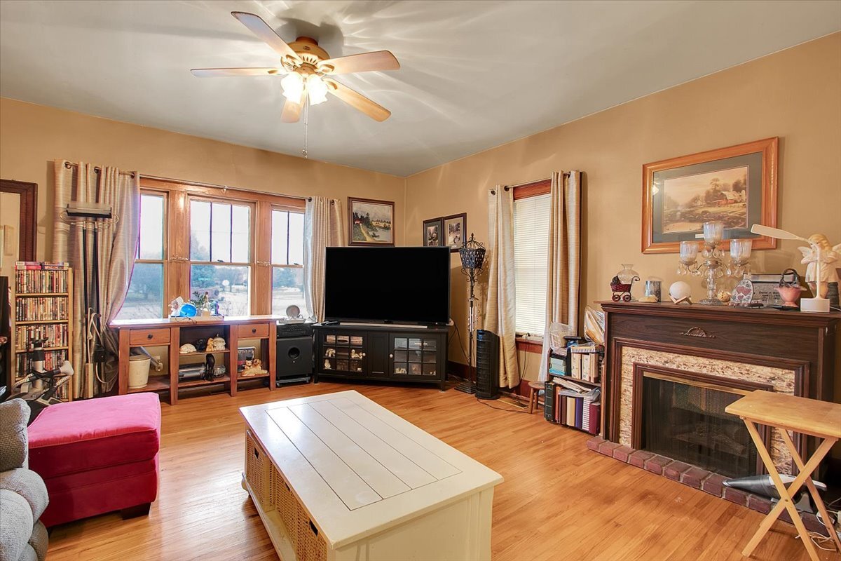 24447 Caton Farm Road Plainfield, IL 60586 - Photo 9 of 27 a living room with furniture and a flat screen tv