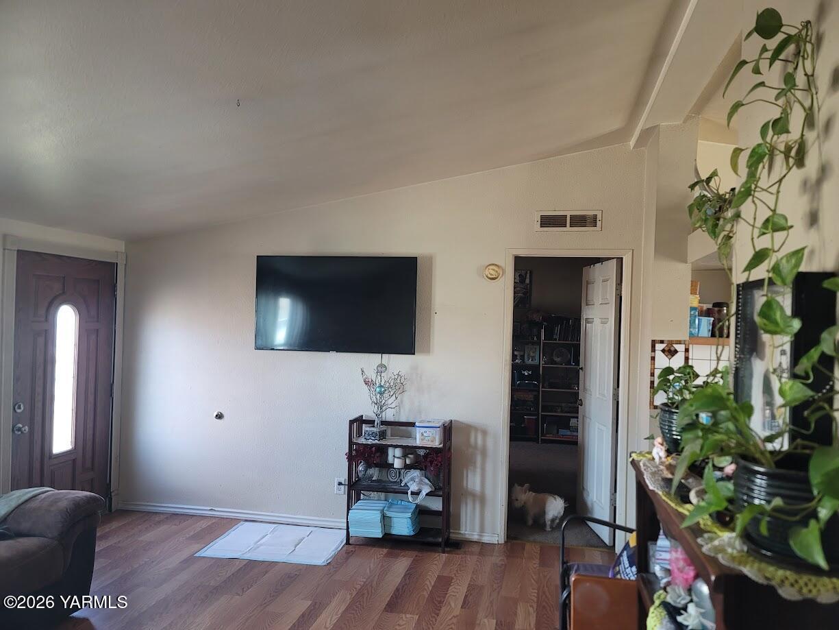 101 West Elizabeth Street Wapato, WA 98951 - Photo 4 of 7 a living room with furniture and a flat screen tv