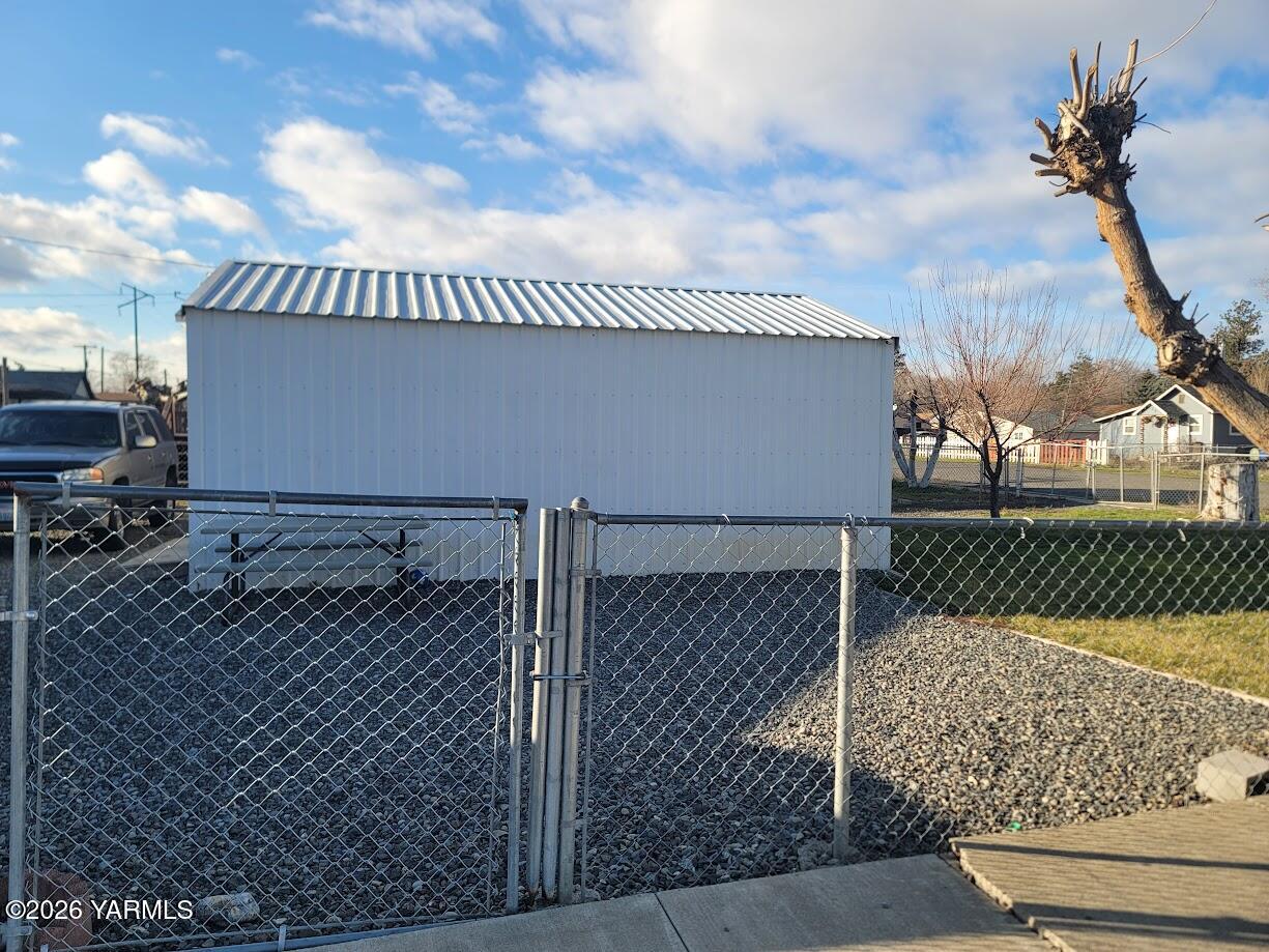 101 West Elizabeth Street Wapato, WA 98951 - Photo 7 of 7 a view of a house with a iron gate