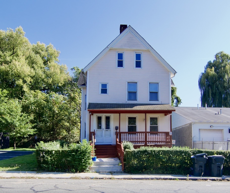 425 Taylor Street, Unit 2 Springfield, MA 01105 - Photo 1 of 28 a front view of a house with a yard
